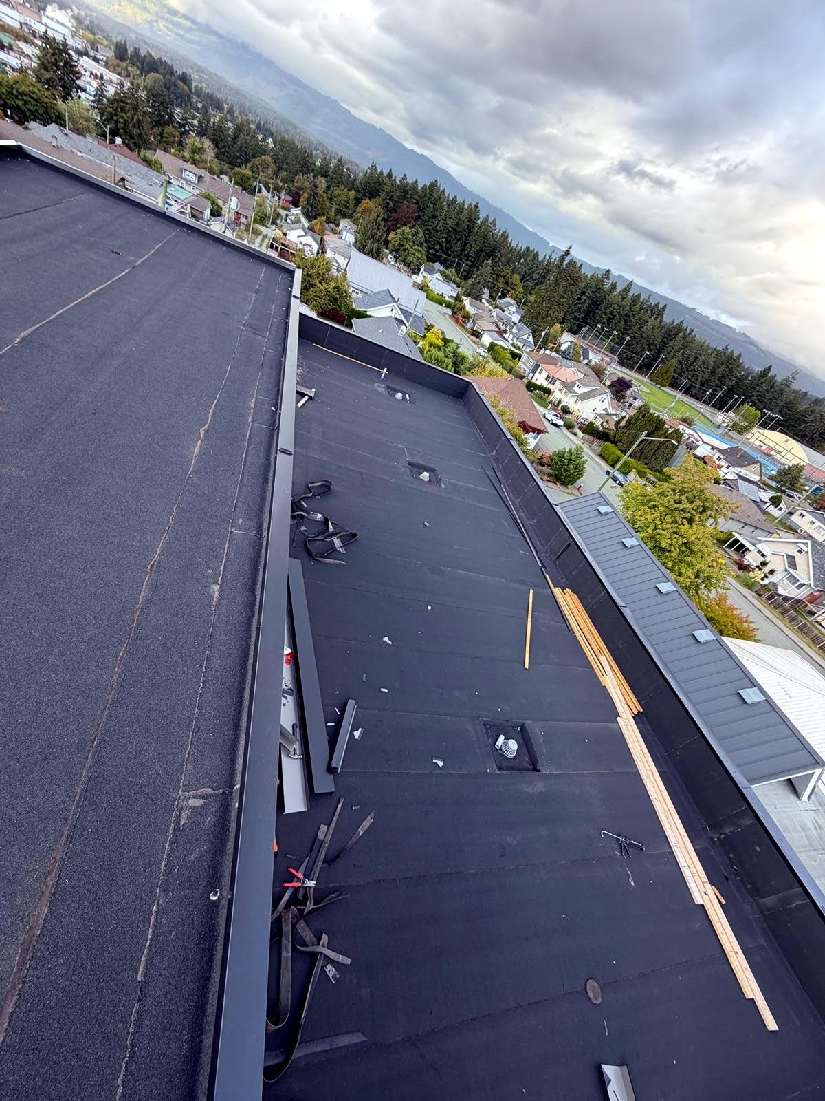 Torch-on membrane flat roof with new flashing on a Duncan building