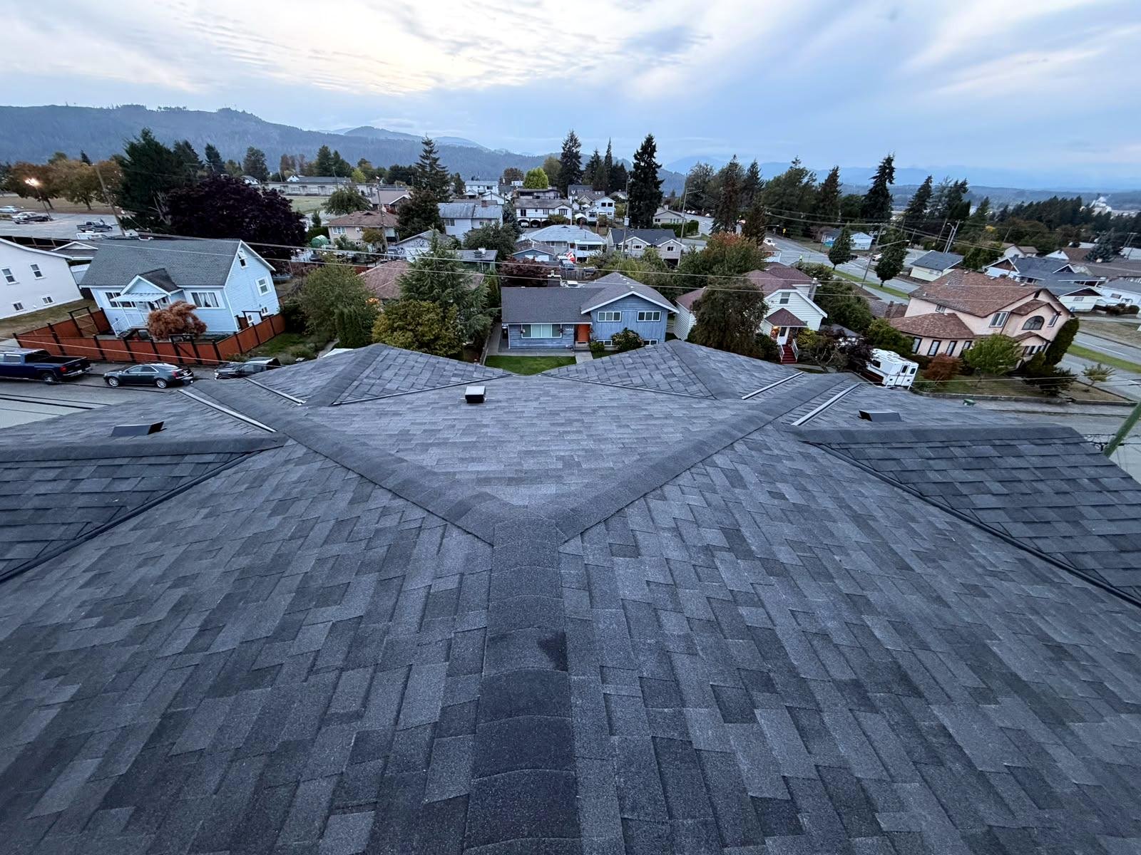 Dark grey shingle roof at dusk on a Vancouver Island home